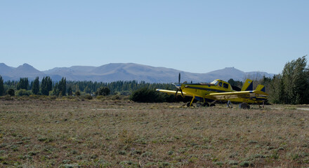 yellow propeller plane in aerodrome. fire hydrant plane fighter in patagonia