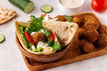 Falafel and fresh vegetables in pita bread