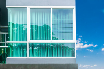 Glass window and curtain. facade modern glass luxury residential building with curtain inside....