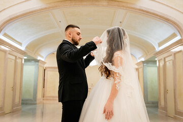 Beautiful wedding couple. Happy bride and luxurious husband.