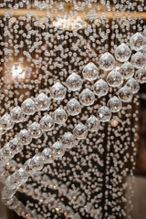 Beautiful chandelier, crystals close-up. Glass jewelry