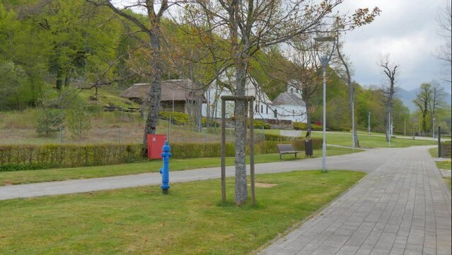 Street leading to Nikola Tesla's birthplace in Smiljan and the Saints Peter and Paul Church where his father served. The birthplace turned into Memorial Center.