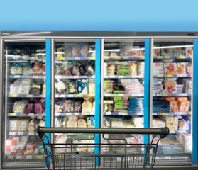 choosing a dairy products at supermarket.empty grocery cart in an empty supermarket