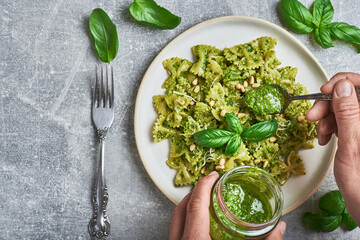 Pasta with basil pesto sauce. Farfalle pasta with basil pesto sauce. Pasta al pesto genovese.