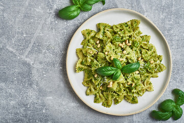 Pasta with basil pesto sauce. Farfalle pasta with basil pesto sauce. Pasta al pesto genovese.