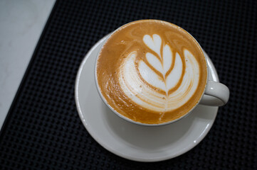 hot latte art coffee on table, relax time