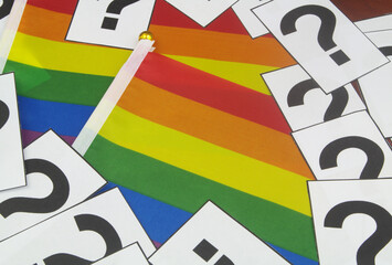 LGBT faq concept. Many question marks on LGBT flags background.