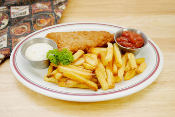 Fish and Chips Dinner Served on a White Plate	