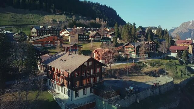 Aerial moving over quaint village of M&uuml;rren in Swiss Alps
