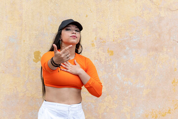 Funky young latin woman hip hop dancing in the street, Panama - stock photo
