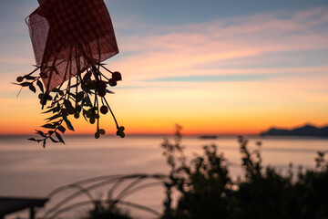 Silhouette of mistletoe with spnoramic sunset view from Praiano at Mediterranean Sea, Italy,...