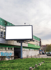 Billboard, mockup, against the background of old houses, horizontal