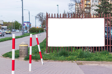 Mockup, white background for an ad, a fence on the background of the road close-up