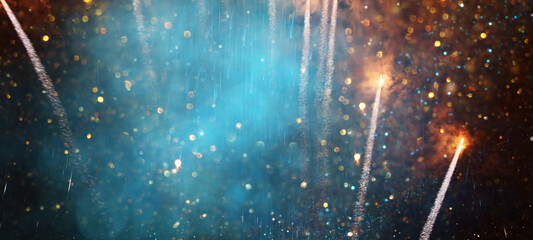 background of abstract gold, black and blue glitter lights with fireworks. defocused