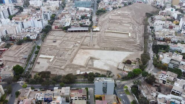Drone video, recorded tilting the camera up to reveal archaeological inca site in district of Miraflores in Lima Peru, called "Huaca Pucllana"