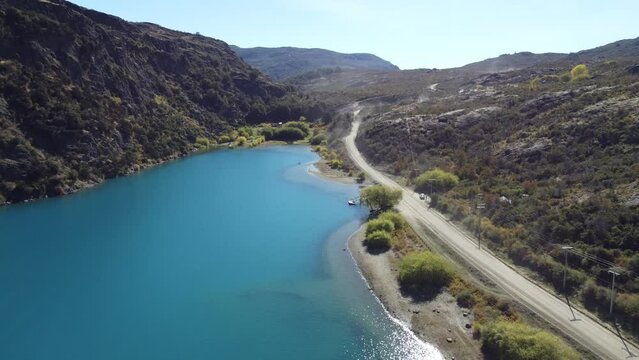 Top aerial drone panoramic view Beautiful mountains landscape and river along gravel road Carretera Austral in southern Patagonia, Chile