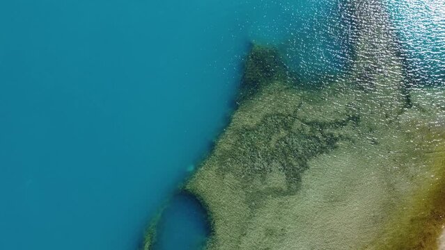 Top Down Aerial Drone View of the impressive Baker River. Bird Eye View over Caribbean Turquoise Cristal Clear Water in Patagonia, Chile.