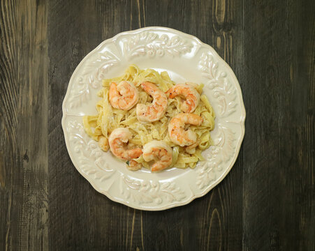 Linguini pasta with a creamy buttery sauce with scallops and jumbo shrimp.