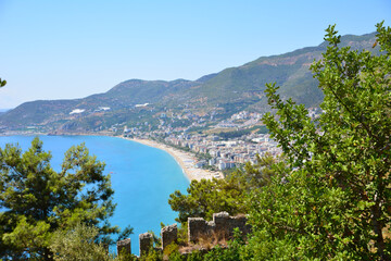 Alanya town with kleopatra beach and turquoise sea, view from top of mountain in sunny day