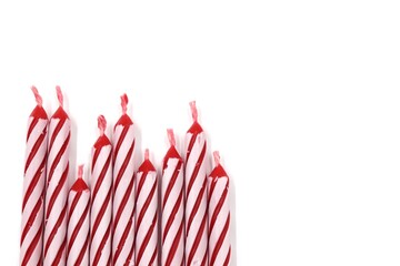 red candles arranged on a white background