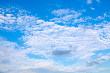 Naklejka na ściany i meble blue sky with clouds, blue background.