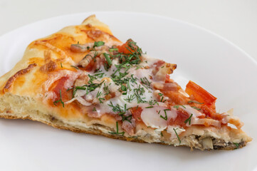 Slice of pizza on white table