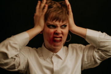 woman is a psychopath with schizophrenia and mental disorders. Portrait of a paranoid with anxiety on a dark background