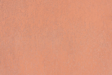 Grunged Plaster Wall painted in Terracotta Color.