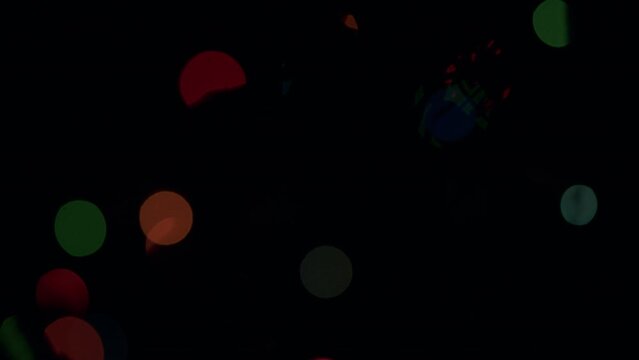 Winter fir tree with magic holiday lights. Multicolored defocused lights blinking. Static.