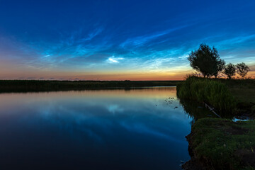 Fototapeta na wymiar Noctilucent clouds also polar mesospheric clouds or night shining clouds