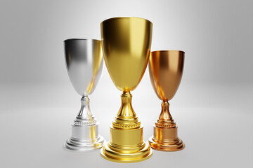 3d illustration of gold, silver and bronze winners cup isolated on gray  background. 3D visualization of the award for sports achievements