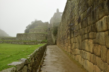 Fototapeta na wymiar Ruins of the ancient Inca city machu picchu in fog, Peru