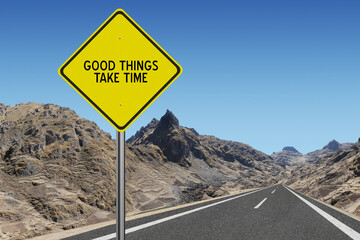 Good Things Take Time motivational quote on sign.