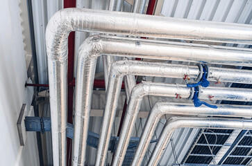 pipeline in a heat-insulating covering at production plant