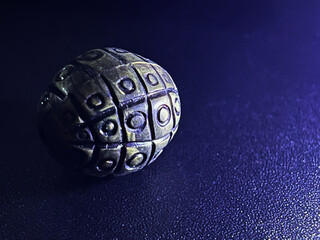 bead placed in dark background photo