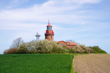 Fototapeta na wymiar Lighthouse Buk in Bastorf, Rostock district, Mecklenburg-Vorpommern, Germany. Historic lighthouse on the Bay of Mecklenburg, Baltic Sea. 