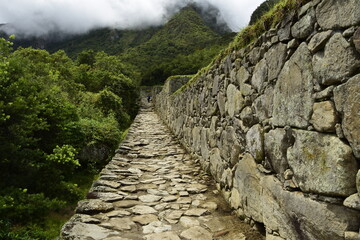 Ruins of the ancient Inca city machu picchu in fog, Peru
