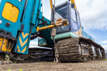 mechanical hammer of a pile driver standing on a technological surface