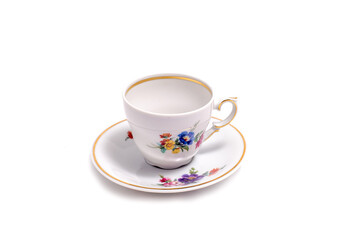 vintage tea cup and saucer isolated on white background