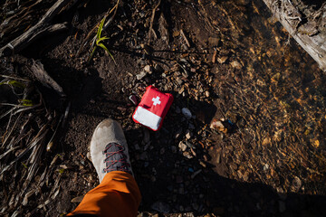 The first aid kit fell to the ground, the man lost a red bag with a cross, a foot in a shoe, a...
