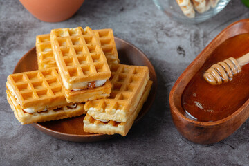Breakfast with Belgian waffles and honey