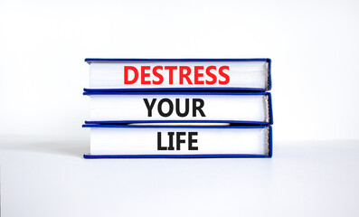 Destress your life symbol. Concept words Destress your life on books. Beautiful white table white background. Psychological business and destress your life concept. Copy space.