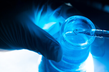 blue science experiment glass tube,Researchers with chemistry test tubes in a liquid glass lab for analytical, medical, pharmaceutical and scientific research concepts.
