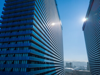 Drone view of modern stylish multi-storey hotel buildings on a sunny bright day