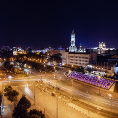 Fototapeta na wymiar Night city center streets with long exposure. Aerial view on Dormition Cathedral with illumination. Downtown streets in Kharkiv, Ukraine