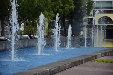 Water fountains in a public space near an area of the pier boardwalk in Guayaquil