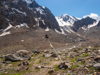 Automatic weather station in the mountains. Distant mountain range, obtaining seismic and...