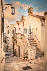 Alley with traditional houses in Monte Sant'Angelo, Foggia, Italy