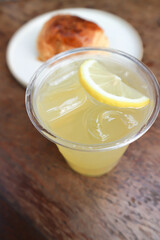 lime juice or lemon juice, lemon soda or tonic or soda and lime slice and bread