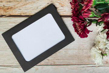 Chalkboard frame on wooden desk. Directly above, flat lay, copy space.